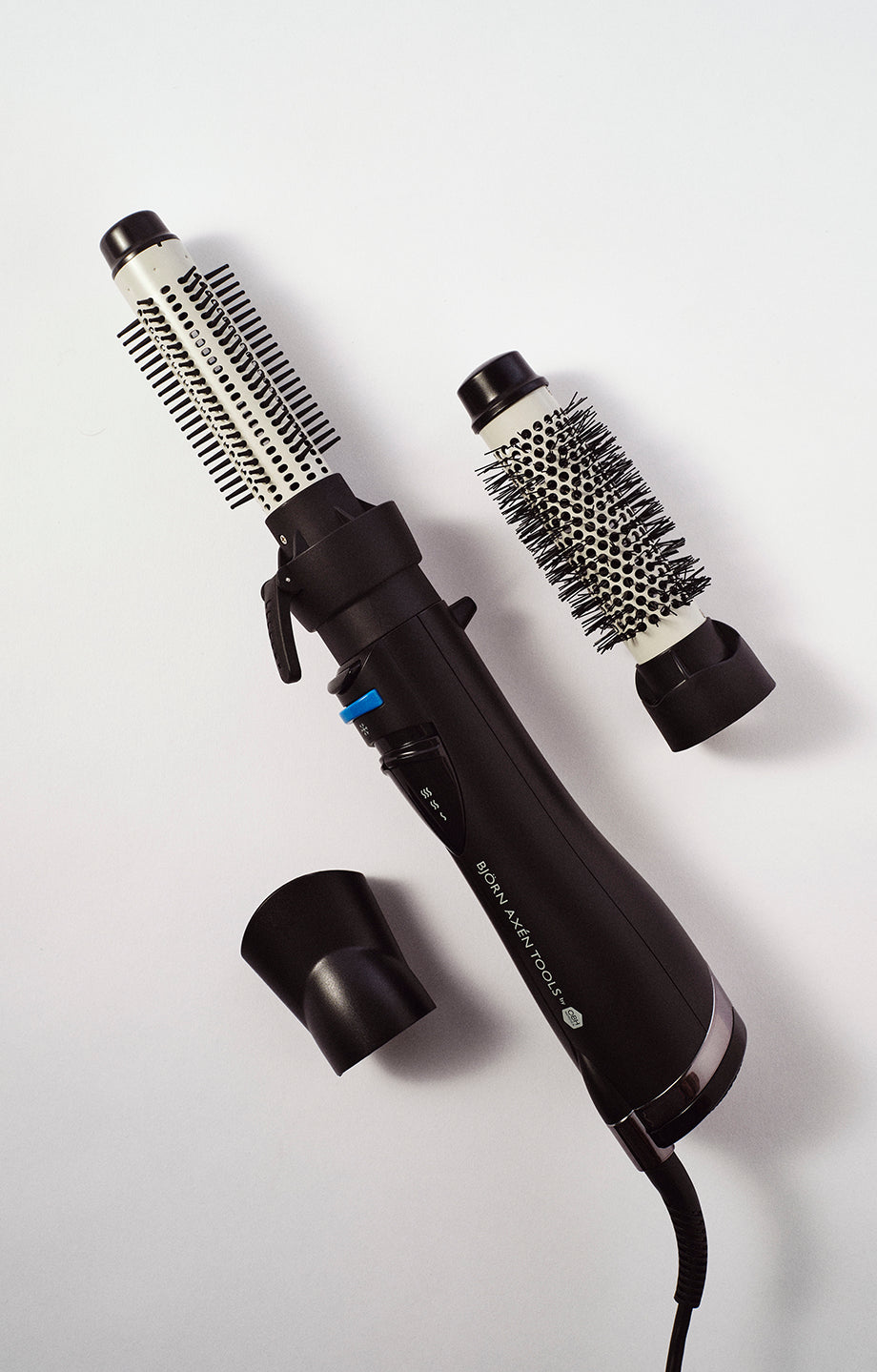 A versatile hot air brush with 2 interchangeable brush heads