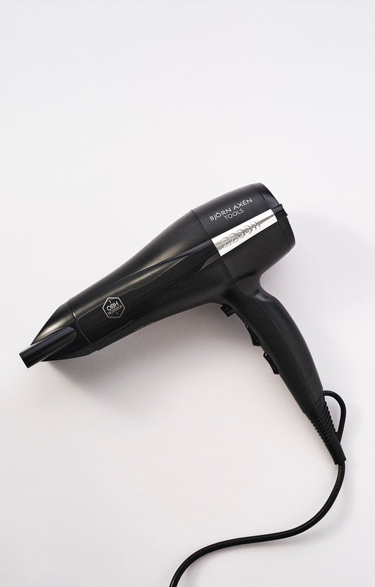A hair dryer with a narrow nozzle for precision styling