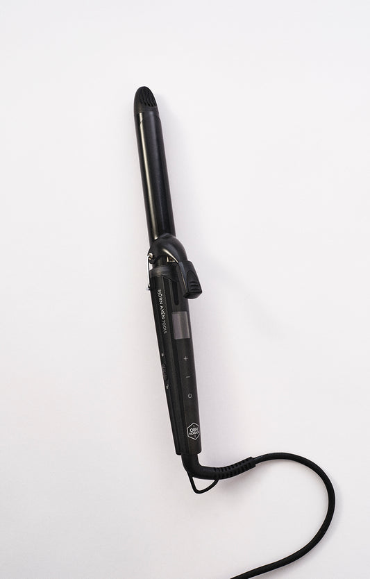 A curling iron with ceramic keratin coating for gentle styling
