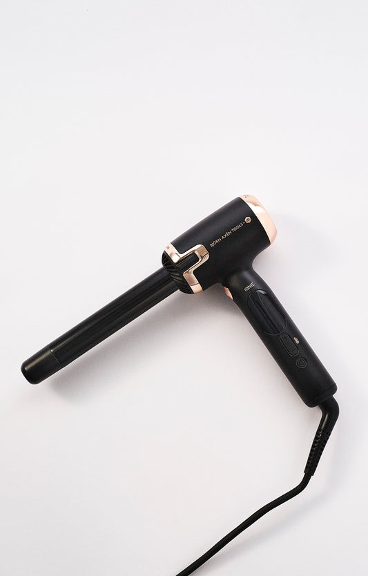 An ergonomic L-shaped curling iron for easy styling